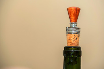 Wine stopper on wooden background close