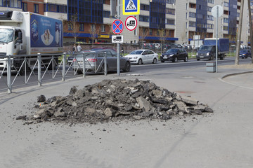Russia, Saint-Petersburg - may 19, 2017: cityscape - a lot of pieces of asphalt on the sidewalk