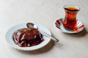 Turkish Pudding Muhallebi with Chocolate Sauce and Traditional Tea.