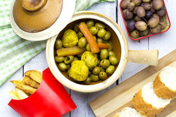 arabic tajine food of green olives with kufta and fried potato