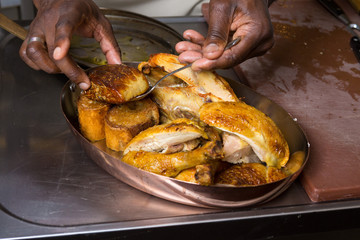 Roast chicken Foie gras being served in a metal pan