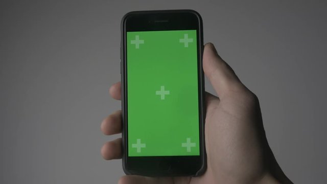 Close Up Man Holding Smartphone Touch With Green Screen Chroma Key