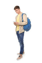 Trendy teenage boy with mobile phone on white background