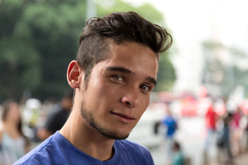 Serious Young Man Looking into the Camera