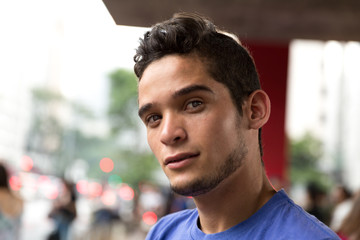Fototapeta premium Man Looking into the Camera in Paulista Avenue, Brazil