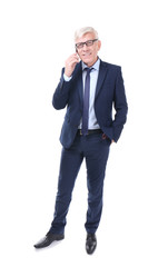 Attractive mature businessman talking on phone on white background