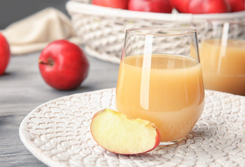 Glass of delicious apple juice on table © Africa Studio