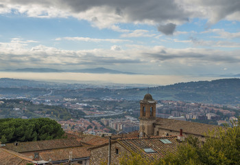Italy, Toscana panorama with fog on distance