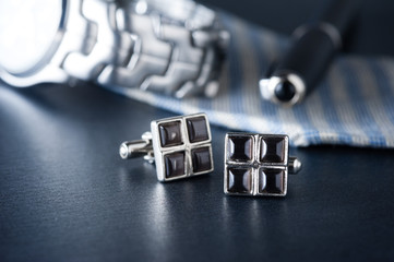 shiny cufflinks with gemstones