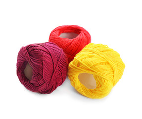 Colorful threads on white background