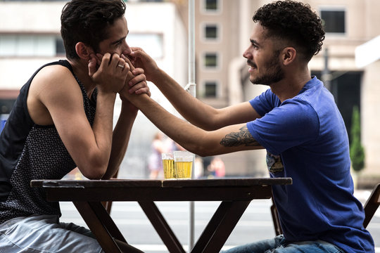 Gay Couple Kissing In Pub Street