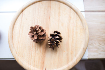 cones of spruce on a wooden board. cones lie on a background