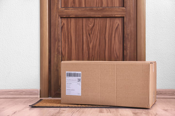 Parcel box on floor near door