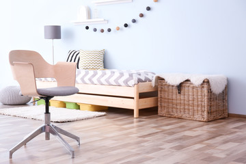 Interior of bedroom with comfortable armchair