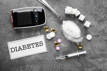 Card with word "Diabetes" and medicaments on table
