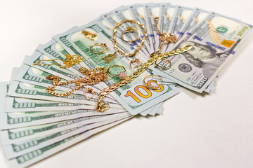 Background of dollars covered in gold.