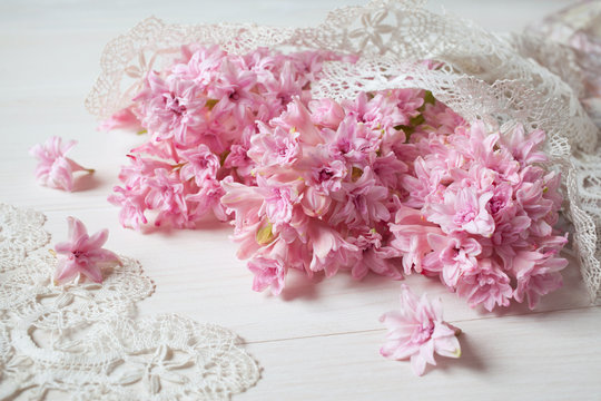Pink hyacinths and lace on the table