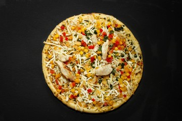 Chicken Fajita Pizza isolated on black with copy space