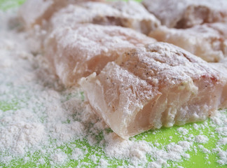 Raw fish fillets ready for frying.
