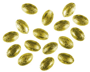 Small, gold wrapped Easter eggs, chocolate, isolated on white background.
