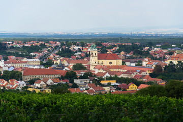 Fototapeta na wymiar Church and castle in Valtice baroque town panorama, part of UNESCO World Heritage Site, Moravia, Czech Republic