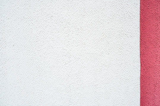 White pink purple purple wall, concrete background, vertical stripes. Half-colored strip, two-color and three-color texture