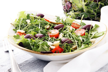 Salad with cheese and fresh vegetables and arugula. Greek salad.