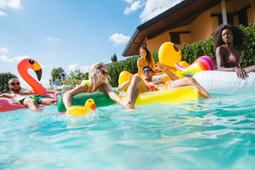 Friends having fun in a swimming pool