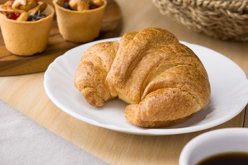 fresh croissant on white dish
