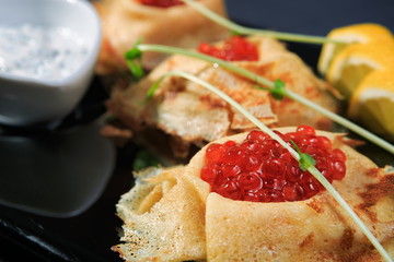 Pancakes with red caviar