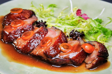 Duck breast with sauce on a plate