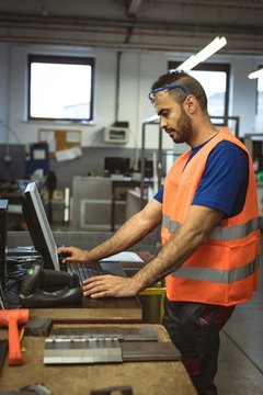 Male worker working on computer