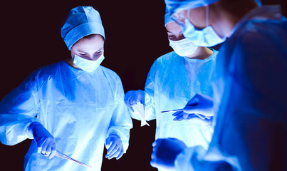 Team surgeon at work in operating room