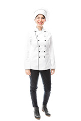 Cute female chef in a studio