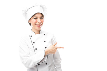 Cute chef pointing to copy space