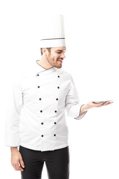 Male chef holding an empty plate