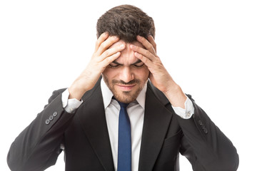 Man in a suit looking overwhelmed