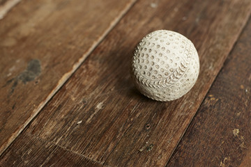Old Vintage Baseball on wooden
