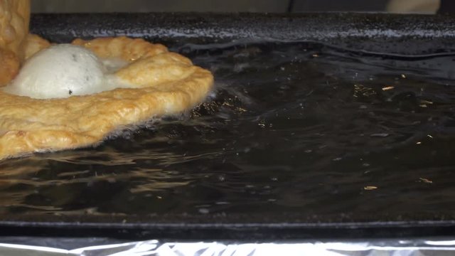 A Czech national food Langosh  boiled in oil.Langosh popular fast food in Old town square in Prague