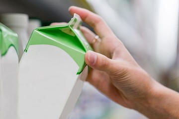 Closeup of a Customer Buying a Product in a Supermarket