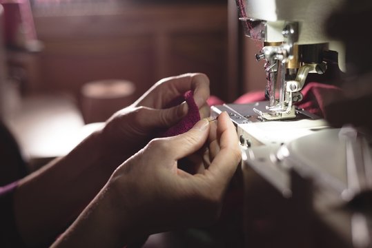 Tailor sewing cloth with sewing machine