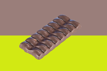 Chocolate bar isolated on a colorful background