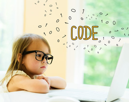 Code text with little girl using her laptop
