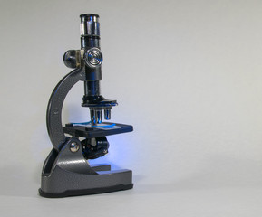 laboratory microscope isolated against white background with blank copy space