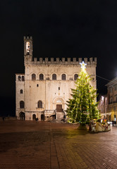 Fototapeta na wymiar Gubbio (Italy) - One of the most beautiful medieval towns in Europe, in the heart of the Umbria Region, central Italy. Here in particular the historic center in the night.