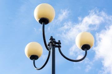 Street post with three lanterns