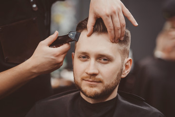 Obraz na płótnie Canvas Barbershop. Hairdressers Barber hair and beard with razor in hair salon