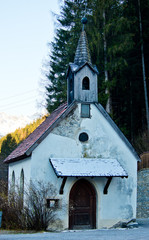 Fototapeta na wymiar small mountain church with snow