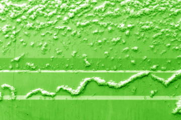 Snow pattern on metal wall in green tone.