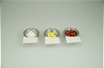 Colorful medications on a light background with empty sticky notes